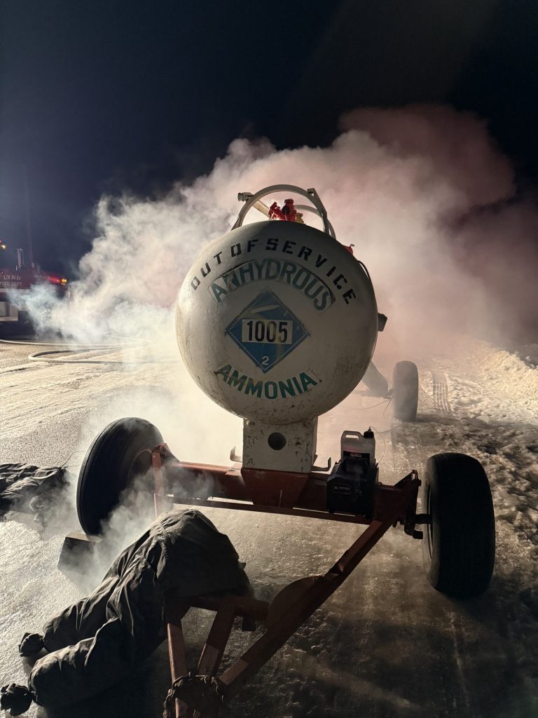 Responder at an ammonia nurse tank venting vapor during a hazmat drill