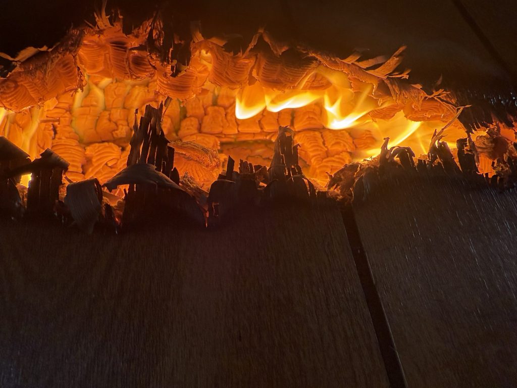 Burning ceiling material fallen into a room during a training burn
