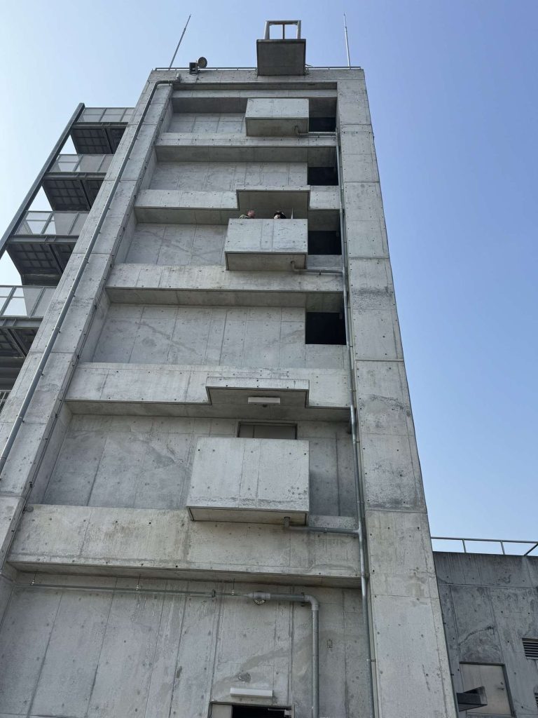 Concrete fire training tower against a blue sky