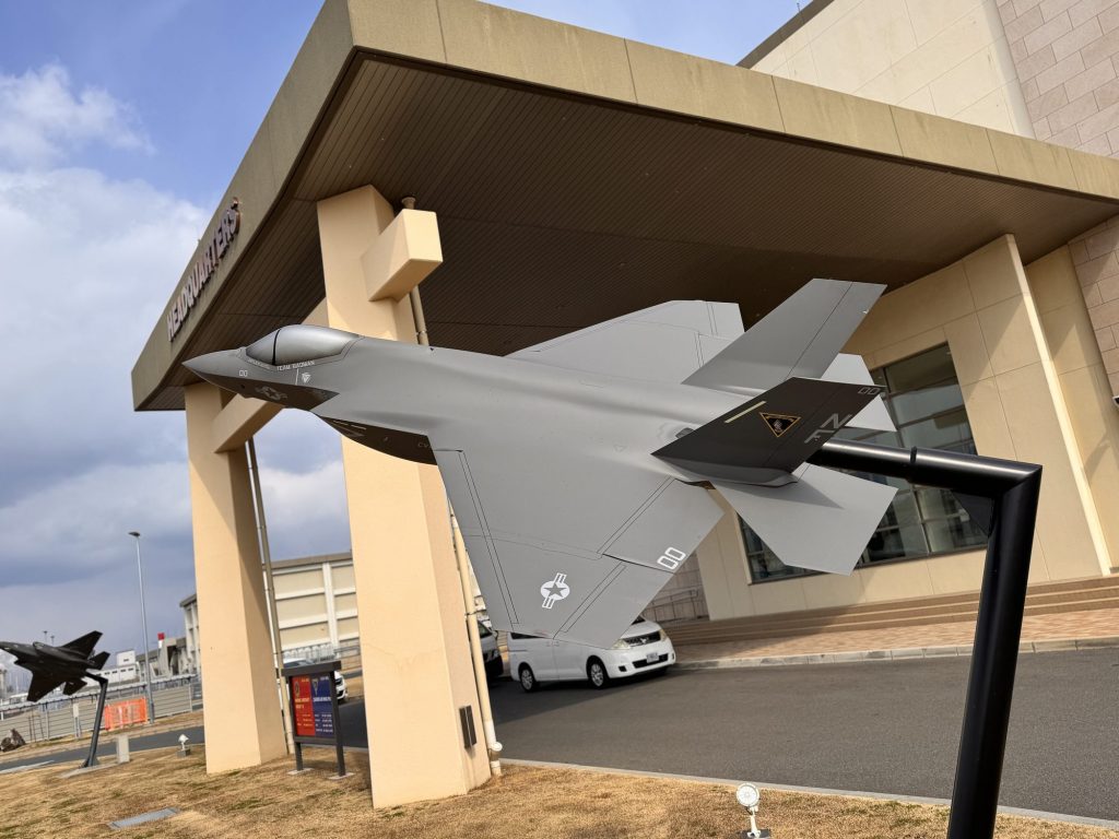 Fighter jet model on display outside a building