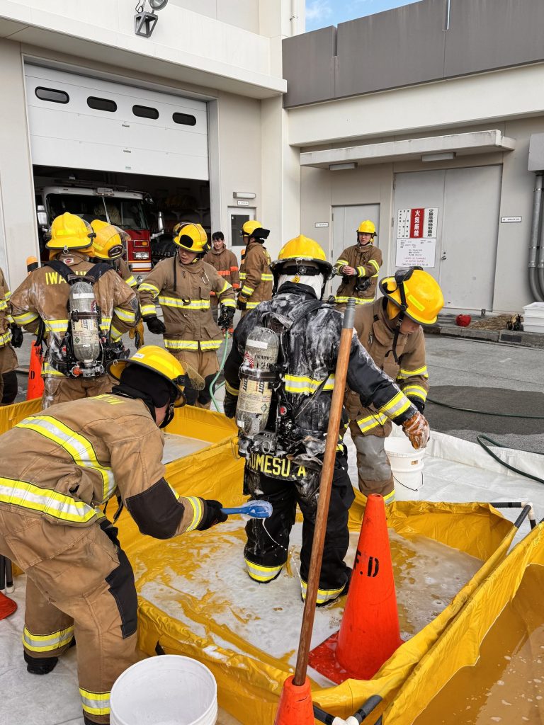 Crew working through a hazmat decontamination line