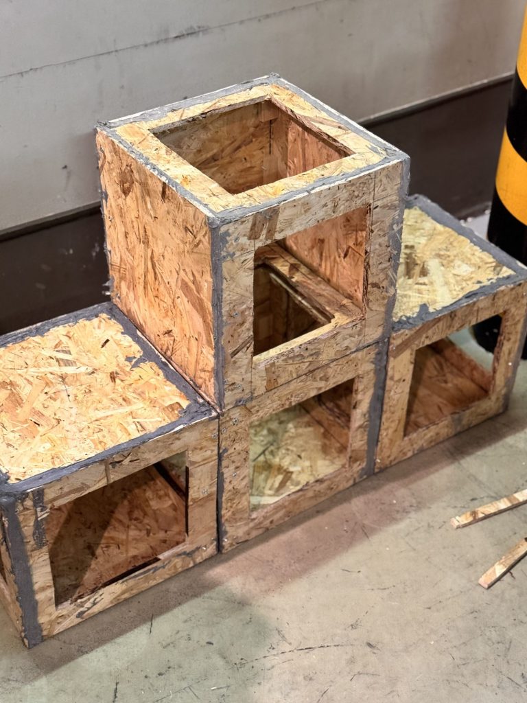 Plywood boxes built as fuel packages for a live-fire training prop