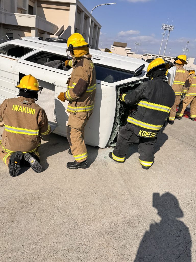 Firefighters stabilizing an overturned vehicle during an extrication drill
